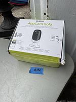 Front view of the Uniden AppCam Solo security camera box showing product image and features.
