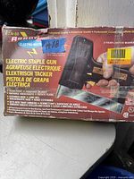 Photo of original boxed Paslode ETN-50 electric staple gun, showing all labeling and warranty details on the packaging.
