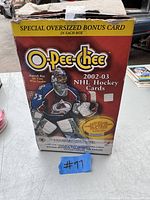 Photo of unopened box of O-Pee-Chee 2002-03 NHL hockey cards with Patrick Roy on front, showing box condition and labeling