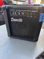 Front view of the Danville TEC10D guitar amplifier showing controls, input jacks, brand logo, and power switch.