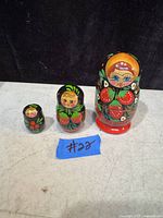 Set of three Ukrainian babushka nesting dolls arranged in descending size order showing detailed hand-painted designs.
