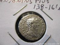 Front side of silver denarius coin showing bust of Emperor Antoninus Pius with surrounding Latin inscription.