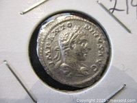 Obverse side of the coin showing the right-facing bust of Emperor Elagabalus wearing a laurel wreath and inscriptions around the edge.