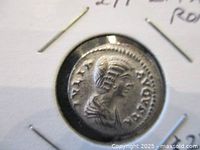 Close-up of the obverse side showing the bust and inscription of Empress Julia Domna with a veiled headdress.