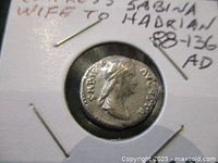 Obverse of the silver Denarius coin featuring the profile portrait of Empress Sabina with laurel wreath and inscriptions around the edge.