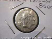 Close-up image of obverse side showing bust of Julius Bursio with laurel or helmet details.