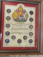 Full view of framed Canadian quarter collection with 14 labeled coins and Canadian coat of arms.