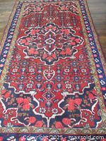 Full top view of rug showing overall pattern and borders