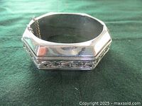 Front view of vintage Whiting & Davis bracelet showing silver-tone finish and engraved floral scrollwork.