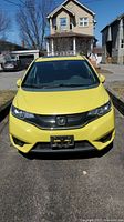 Front exterior view of yellow 2016 Honda Fit FXL