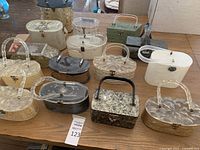 Full lot of acrylic purses arranged on table showing various shapes, colors, patterns