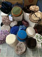 Full display of 19 vintage ladies hats in various materials and styles, showing overall collection condition and diversity.