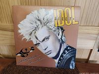 Front cover of Billy Idol Whiplash Smile vinyl album showing color portrait artwork.