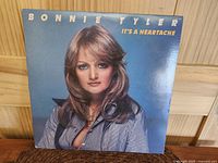Front of the album cover with Bonnie Tyler portrait and album title "It's A Heartache".