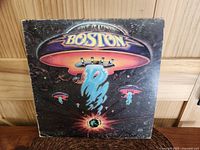 Front cover of 1976 Boston debut album showing original artwork with noticeable wear and scuffing.