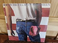 Front cover of Bruce Springsteen Born in the U.S.A. LP showing wear and handling marks.
