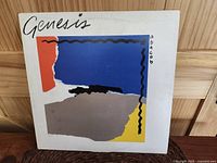 Front cover of Genesis Abacab LP album, showing abstract geometric design and titles.
