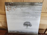 Front cover of Genesis Wind & Wuthering LP showing tree and album title