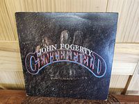 Front of the album cover showing the embossed glove design with title text