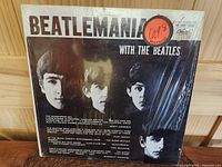 Front of the album cover showing The Beatles' faces with the title 'Beatlemania with the Beatles', original shrinkwrap and sticker.