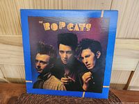 Front cover of The Bop Cats LP album showing three band members and title