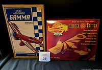 Two boxed die cast coin bank airplanes: 1932 Northrop Gamma Bud Light and Gearbox Shell Stinson Detroiter limited edition.