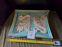 Set of two swan chalkware wall hangings in original box, showing size and condition