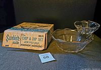 Vintage Anchor Hocking clear glass chip and dip set with 22kt gold rim alongside original box, showing overall excellent condition of the set and worn condition of the box.