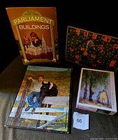 Photo showing Build Your Own Parliament Buildings box, puzzle tray inlay board, and small game box.