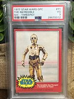 Front view of 1977 Star Wars O Pee Chee C3PO rookie card graded PSA 3 Very Good. Features C3PO in golden color standing with text and Star Wars logo.