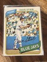 Front of 1980 Dave Stieb Topps rookie baseball card showing player pitching in Blue Jays uniform with name, position, team, and autograph.
