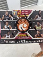 Sealed 2020-21 NBA Chronicles MEGA Box showing NBA player images, including Anthony Edwards and others, with box details including 5 cards per pack and 20 packs per box.