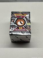 Sealed 2020-21 NBA Chronicles wax blaster box sealed in original Panini black tape, showing front and player images.