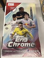 Front view of the sealed 2021 Topps Chrome MLS trading cards box showing player images and branding.