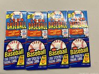 Eight unopened packs of Fleer Baseball trading cards with logo stickers. Four packs from 1988 and four from 1990 visible in original sealed packaging.