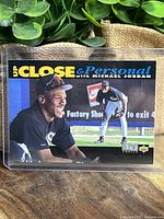 Front of Michael Jordan 'Up Close & Personal' baseball card showing his portrait and action photos in White Sox uniform.