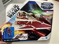 Front view of boxed Star Wars Mission Fleet Delta-7 Jedi Starfighter with Ahsoka Tano figure, new in package.