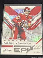 Front of the Patrick Mahomes football card showing the holographic EPIX Momentum design with Mahomes in red Chiefs uniform holding a football.