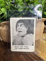 Front of vintage Leaf Spook Stories card showing a man in distress and the caption 'Shut Off That Air Conditioner'.