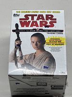 Front view of sealed Star Wars Journey to the Last Jedi wax box showing Rey and box details including number of packs and hit card.