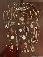 Overview of all assorted jewelry pieces laid out on surface