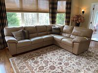 Full view of three-piece sectional sofa in living room