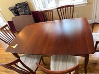Overview of cherry wood dining table with six matching chairs