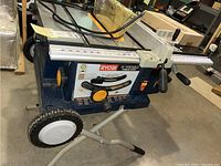 Front view of Ryobi table saw on folding stand