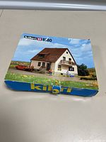 Box front photo showing pictured villa house model and Kibri branding with scale HO 1:87 and model number 8180.