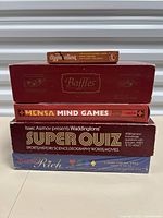 Stack of 5 board games - Aggregation, Baffles, Mensa Mind Games, Waddingtons Super Quiz, Word Rich sealed