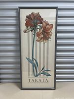 Front view of the framed floral print showing two amaryllis flowers with the full frame visible.