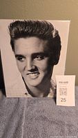 Elvis Presley black and white 8x10 photographic portrait showing smiling close-up headshot and hairstyle.