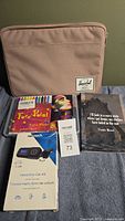 Photo showing pink Herschel pouch, face paint set, Nextech car kit with box, journal with quote cover, and Hershey bag