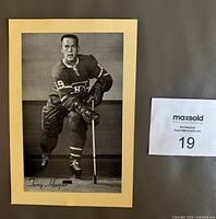 Front of black and white hockey card showing Terry Harper in Montreal Canadiens uniform with stick, mounted on manila backing